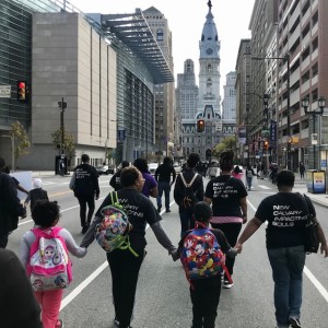 March hand in hand toward Philly City Hall